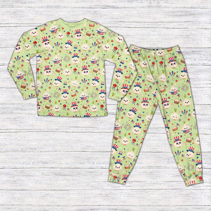 Green matching family fourth of july pajama set featuring a garlic BBQ design, front view
