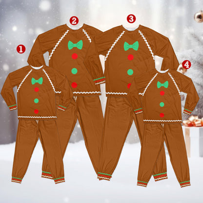 Kids wearing gingerbread pajama sets playing during the holidays