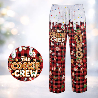 Family wearing the personalized gingerbread cookies pajama set with red accents