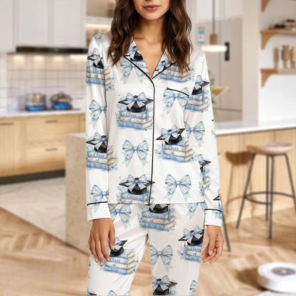 White pajama set with pink and blue bows and graduation design, front view