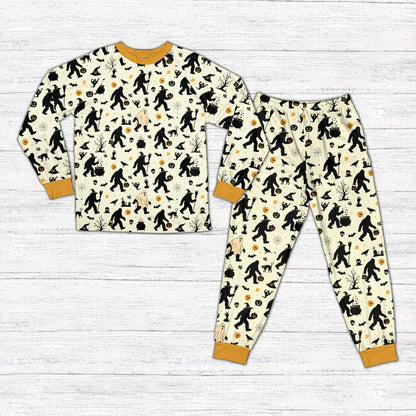 Front view of beige Halloween pajama set with Bigfoot and bat graphics