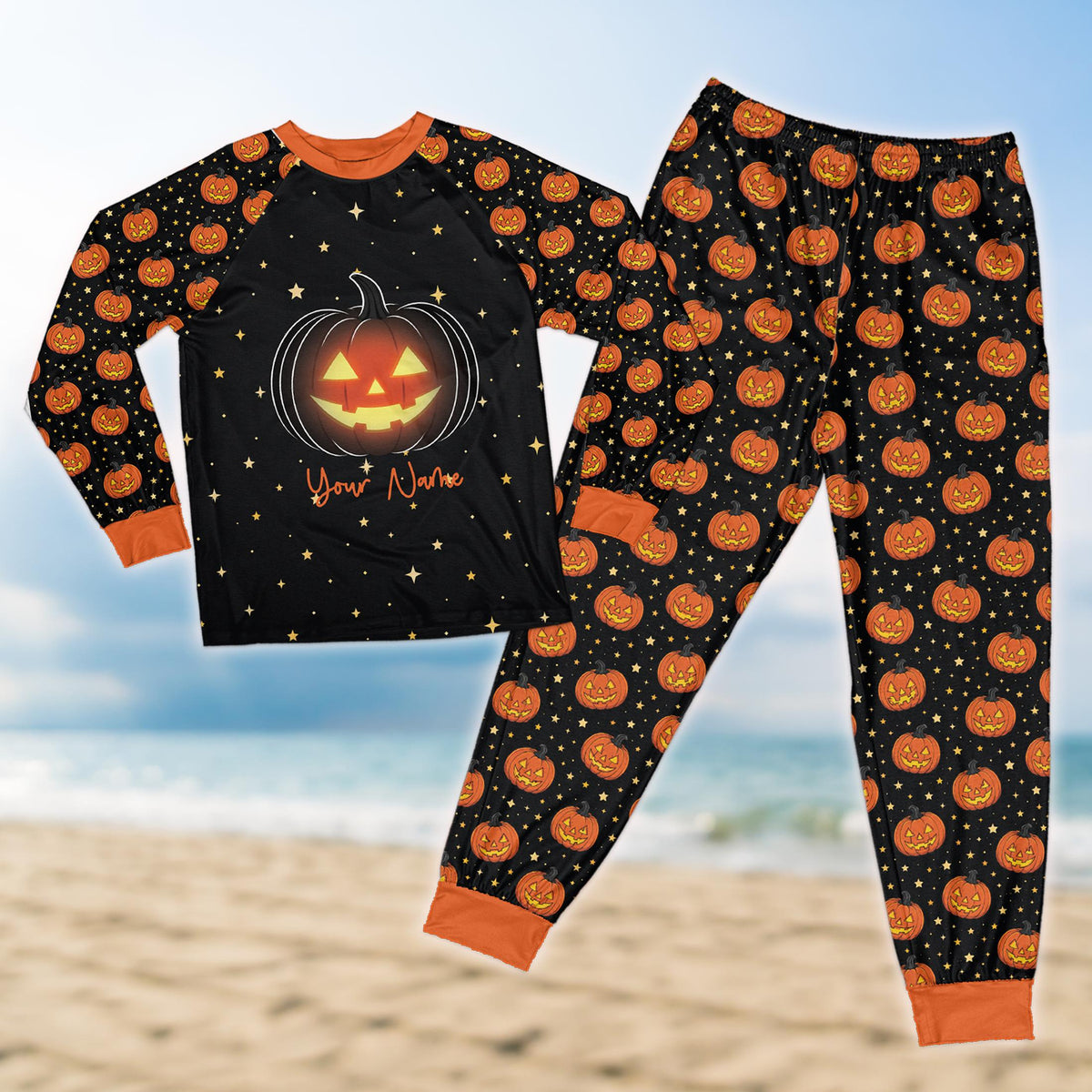 Personalized black halloween pajama set with custom name and glowing jack-o'-lantern design, front view