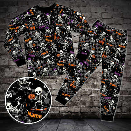Matching holiday pajamas for the family featuring a black skateboard skeleton design and custom name, front view.