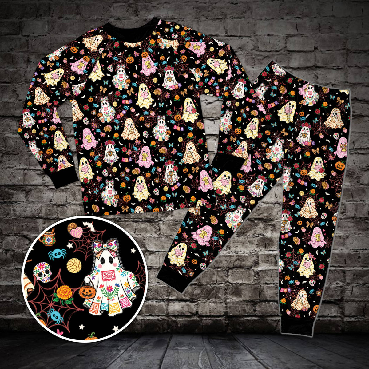 Matching family pajama set in black with Halloween and Dia de los Muertos motifs, front view