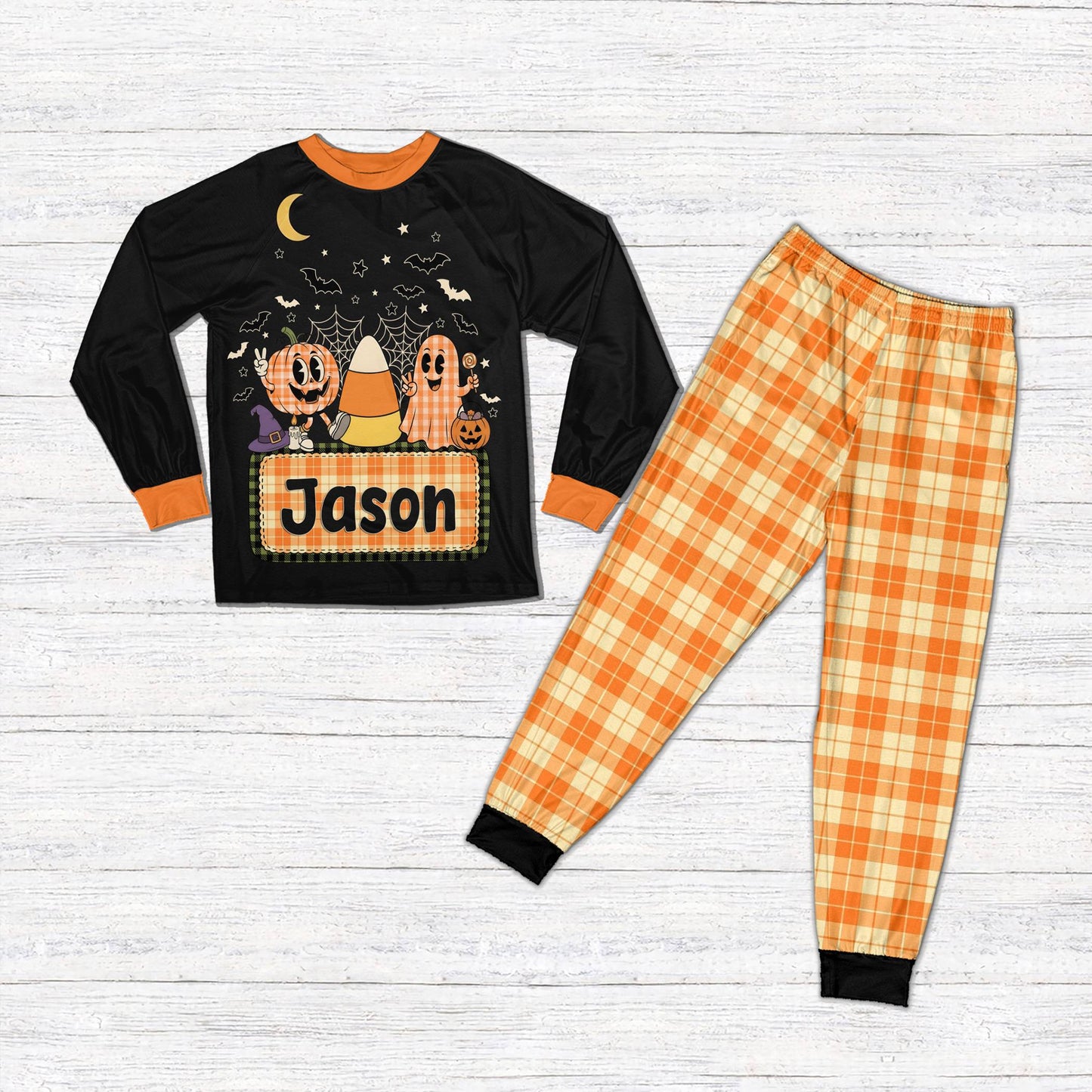 Front view of the personalized Halloween pajama set with black accents