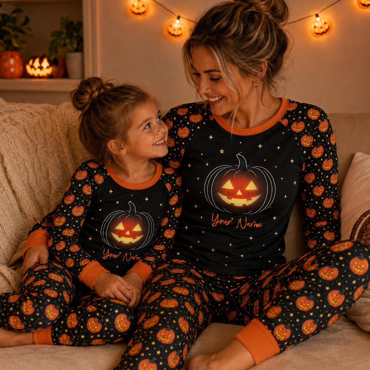 Family wearing matching personalized halloween pajama sets with jack-o'-lantern graphics in a lifestyle setting