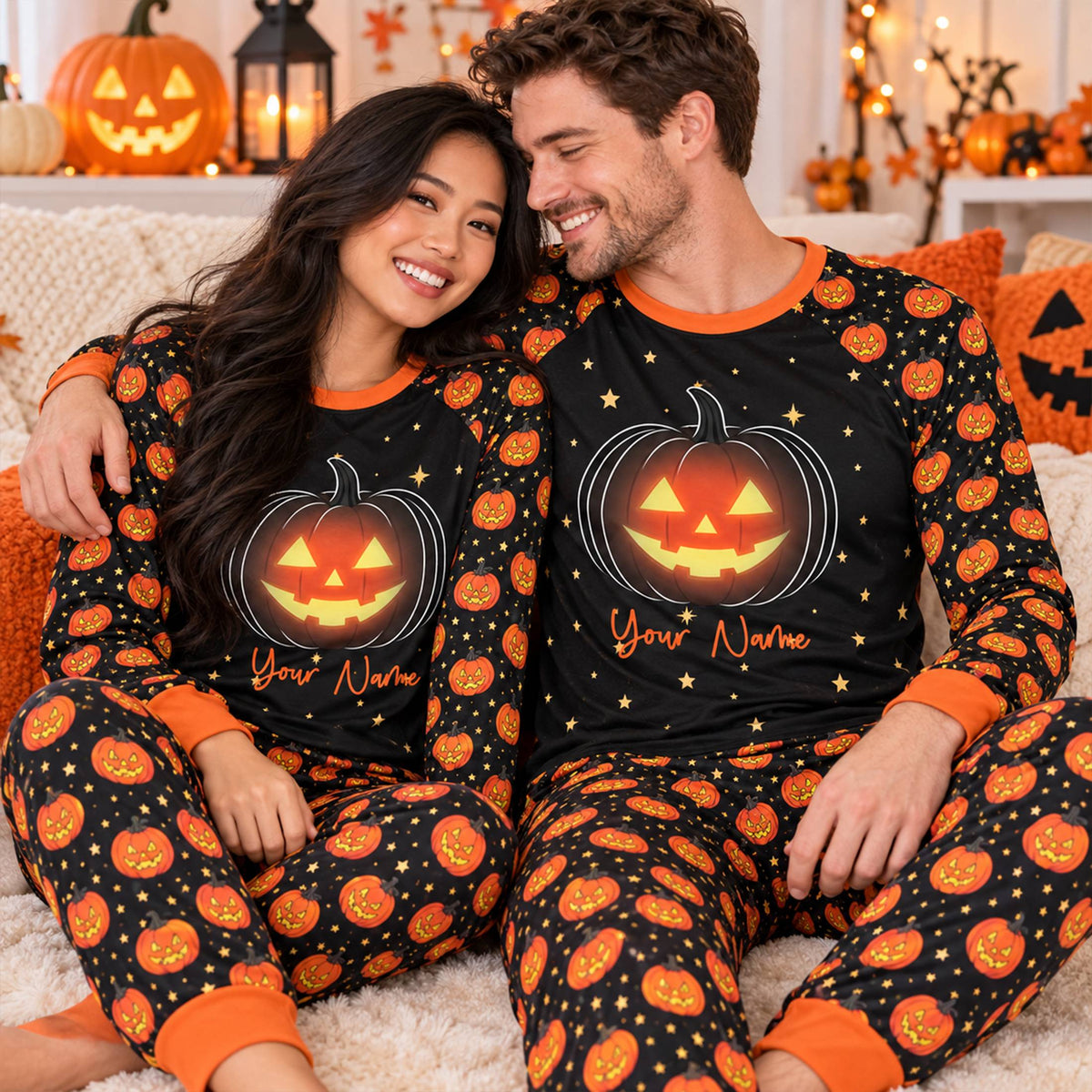 Family wearing matching holiday pajamas with halloween jack-o'-lantern design, lifestyle view