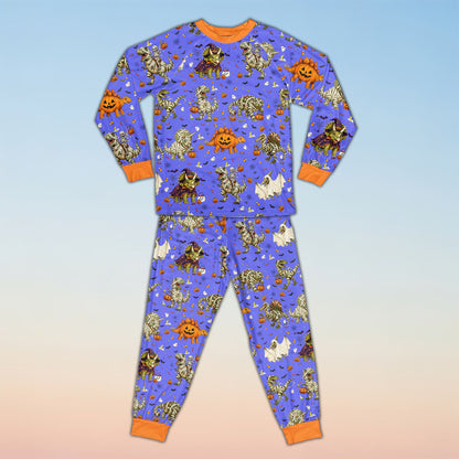 Front view of personalized blue Halloween dinosaur pajama set
