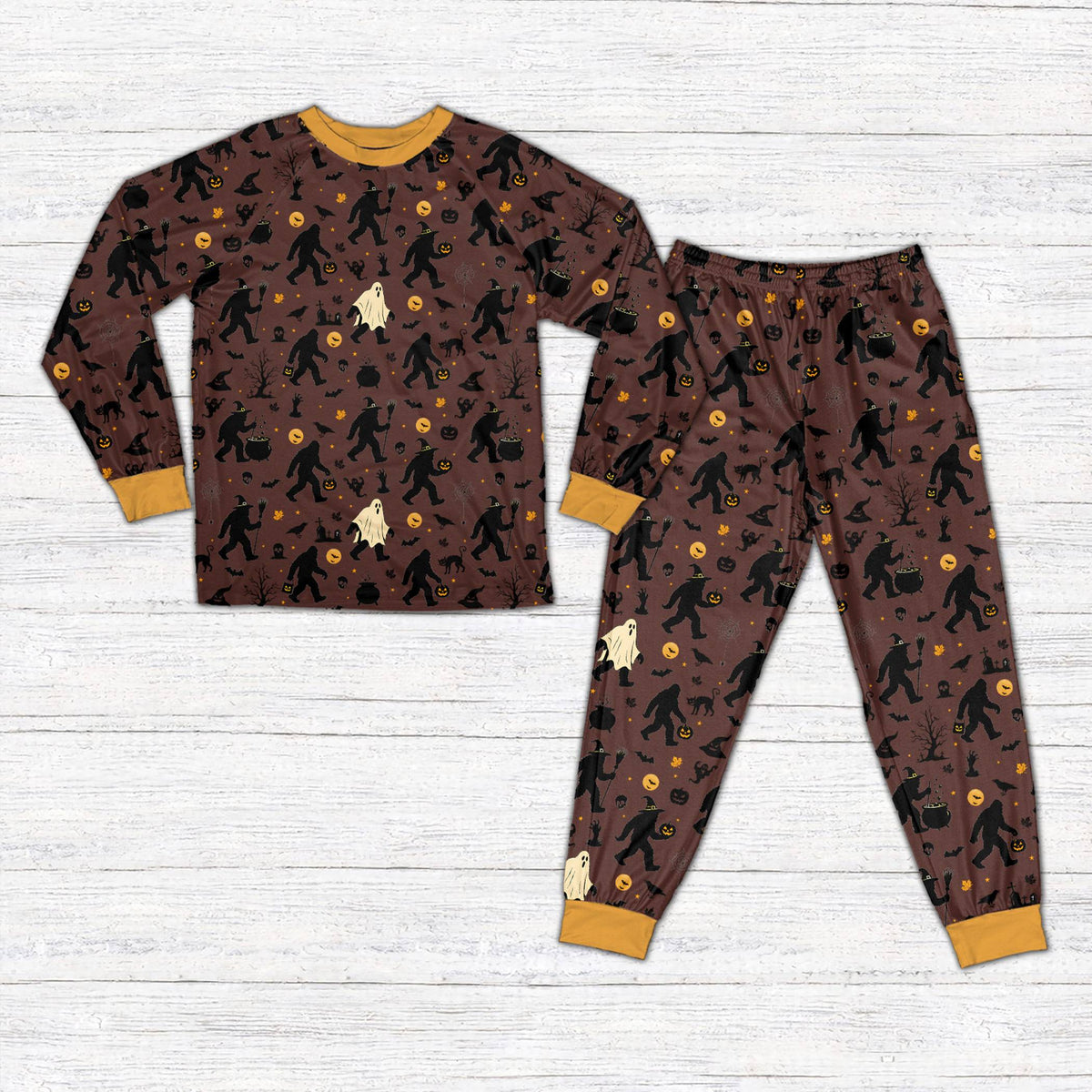 Front view of brown Halloween pajama set with witches and ghosts design