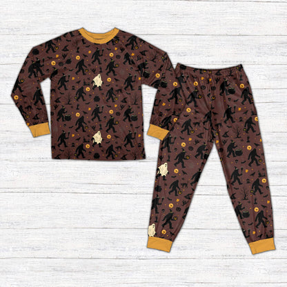 Front view of brown Halloween pajama set with witches and ghosts design