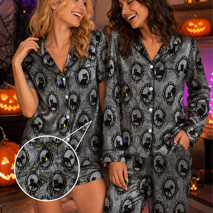 Second lifestyle view of family wearing the matching halloween cats pajama set