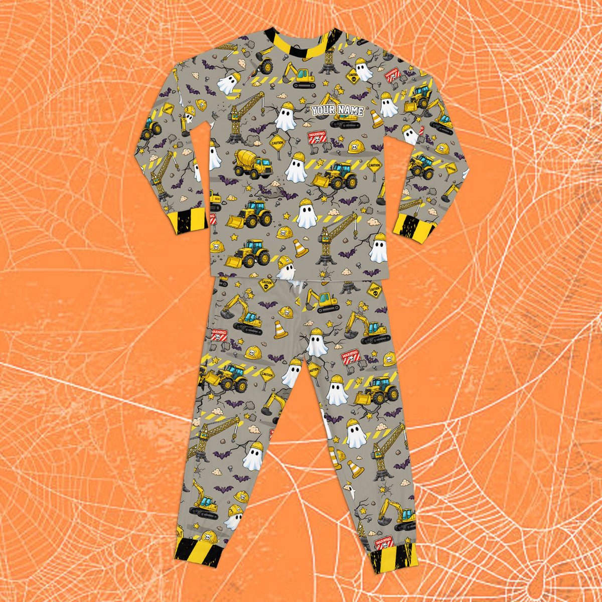 Front view showing the all-over print details of the Halloween construction pajamas.