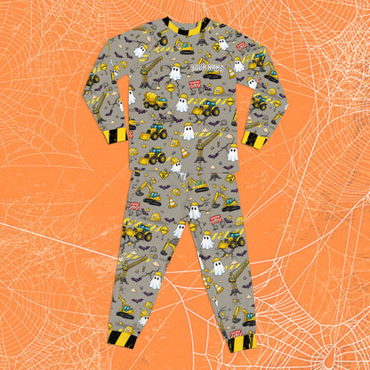 Front view showing the all-over print details of the Halloween construction pajamas.