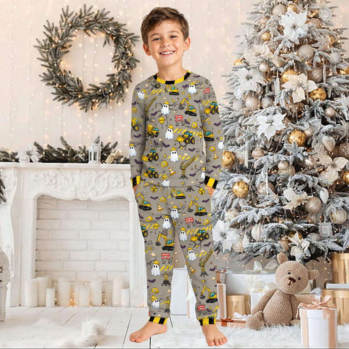 Lifestyle image of a child wearing the custom Halloween construction pajamas.