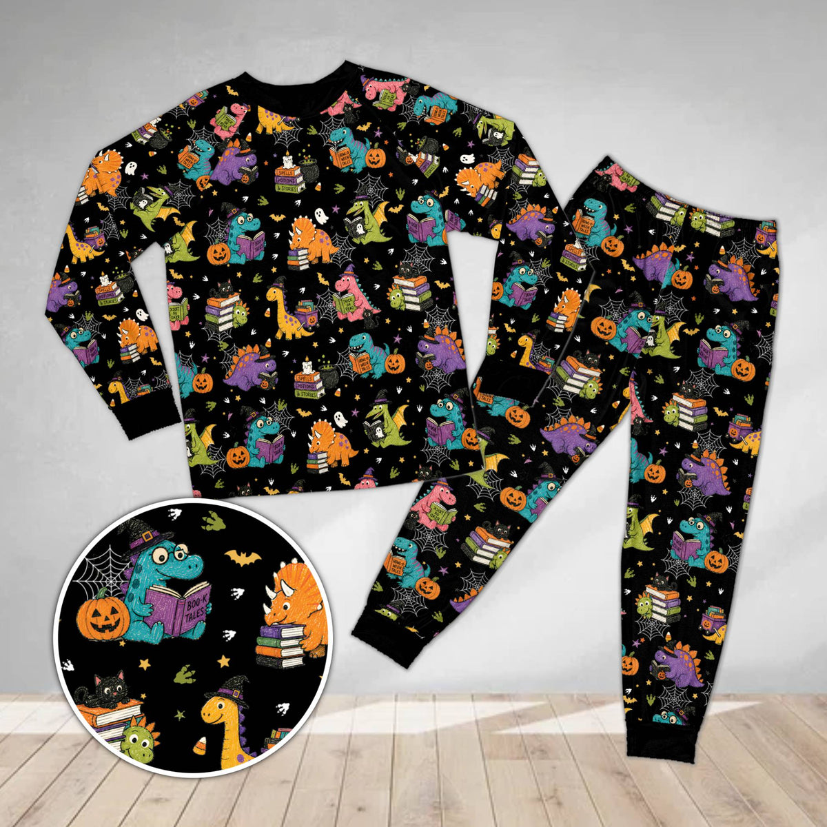 Matching family pajama set with Halloween dinosaurs design on black background, front view