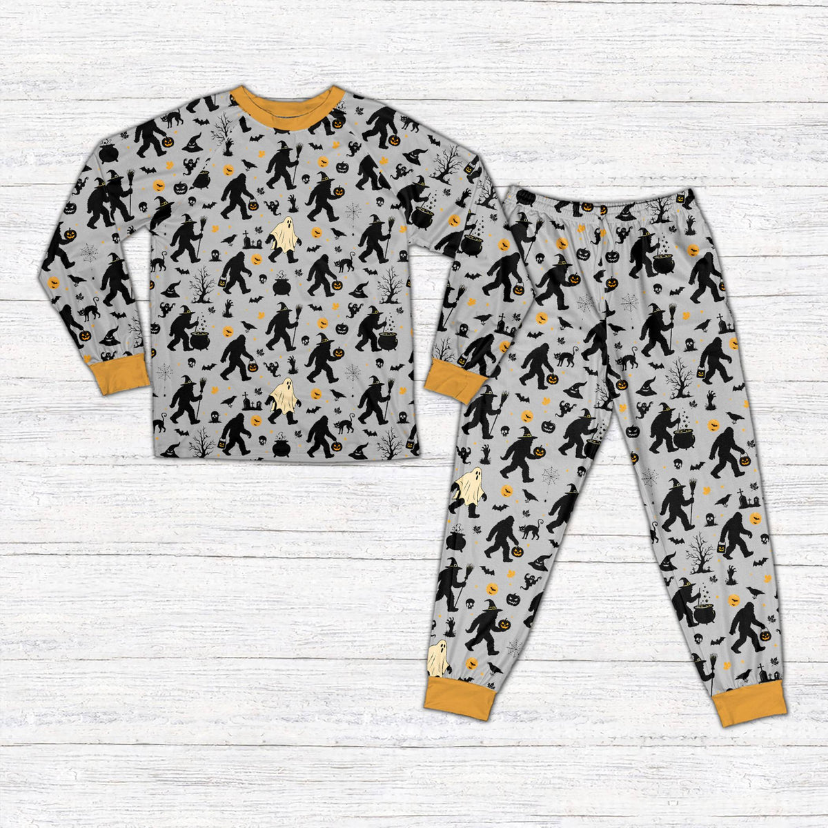 Front view of gray Halloween pajama set with Bigfoot and jack-o'-lantern design