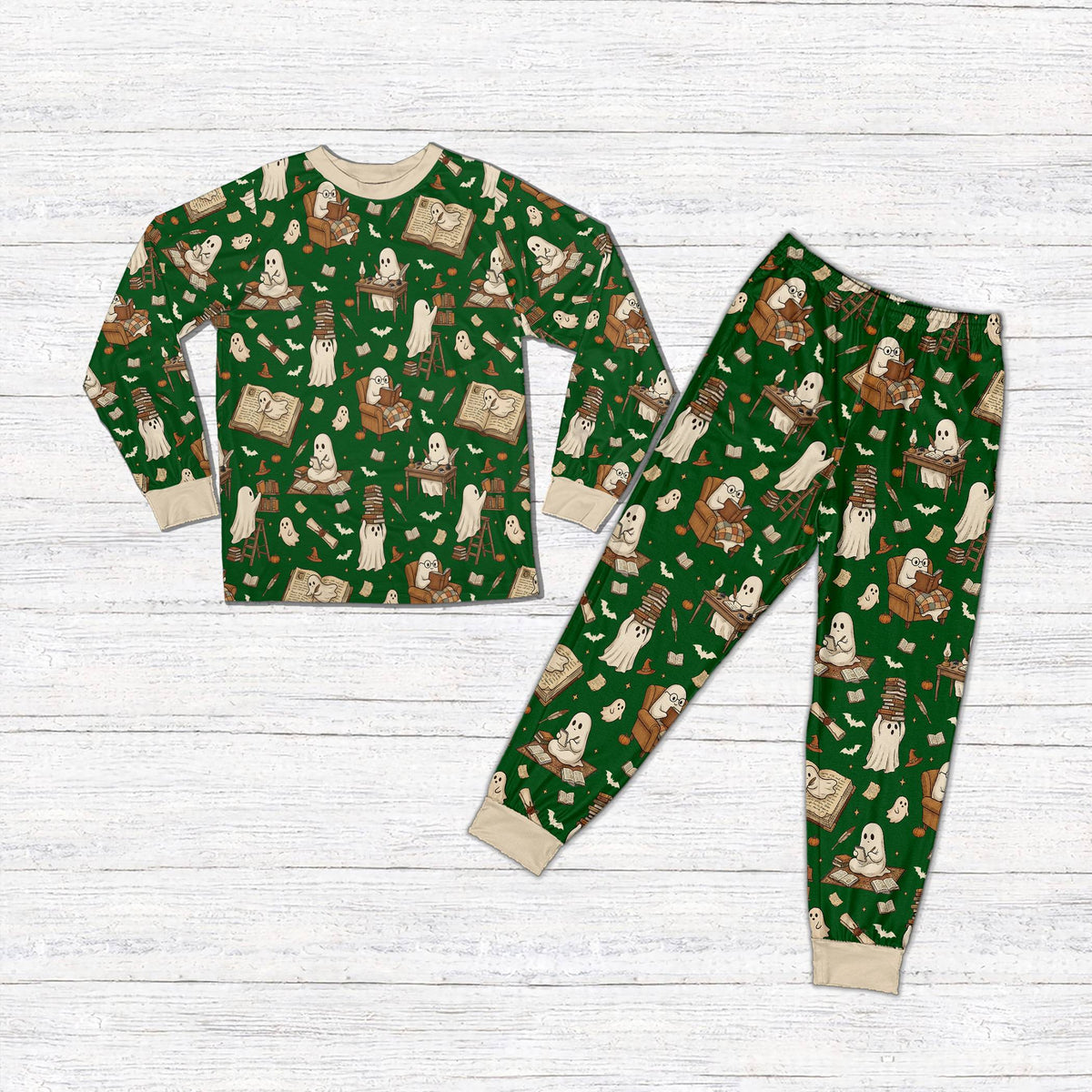 Matching family holiday pajamas with green background and reading ghosts, front view