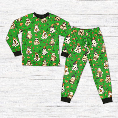 Green family matching holiday pajamas with Halloween ghost and pumpkin pattern, front view