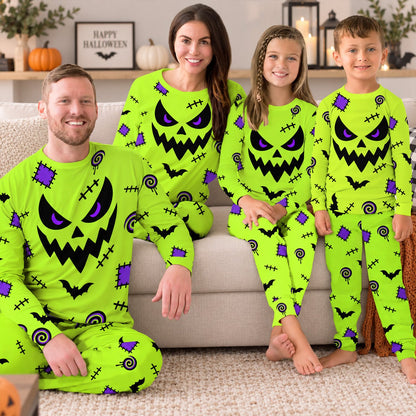 Person wearing the green jack-o'-lantern pajama set relaxing