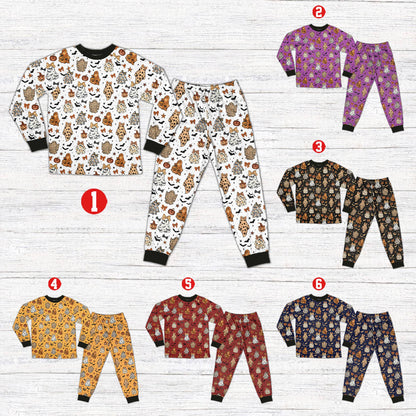 White Halloween pajama set featuring leopard ghosts and pumpkins, front view