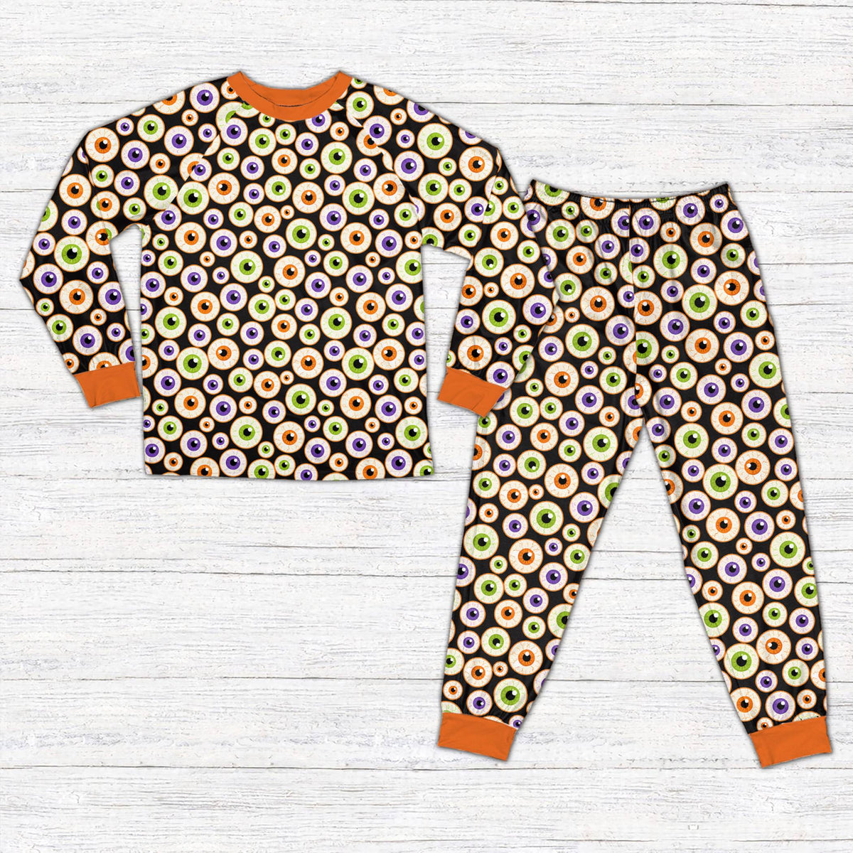 Halloween pajama set featuring a colorful eyeball print, front view detail