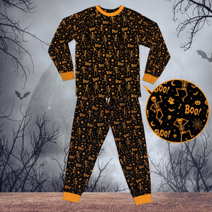 Front view of the matching family holiday pajamas in a spooky design