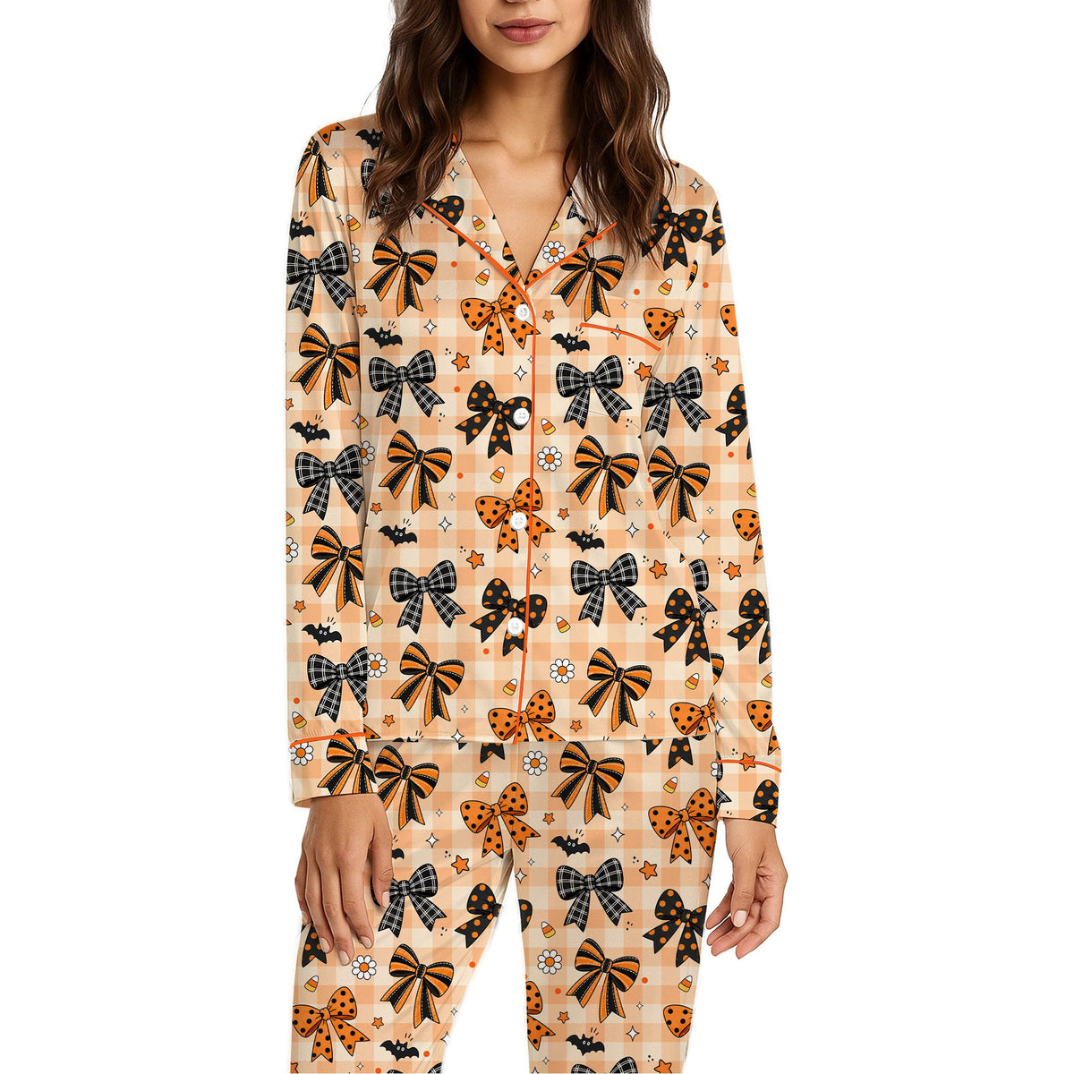 Detailed front view of the Halloween bats candy corn bows pajama set