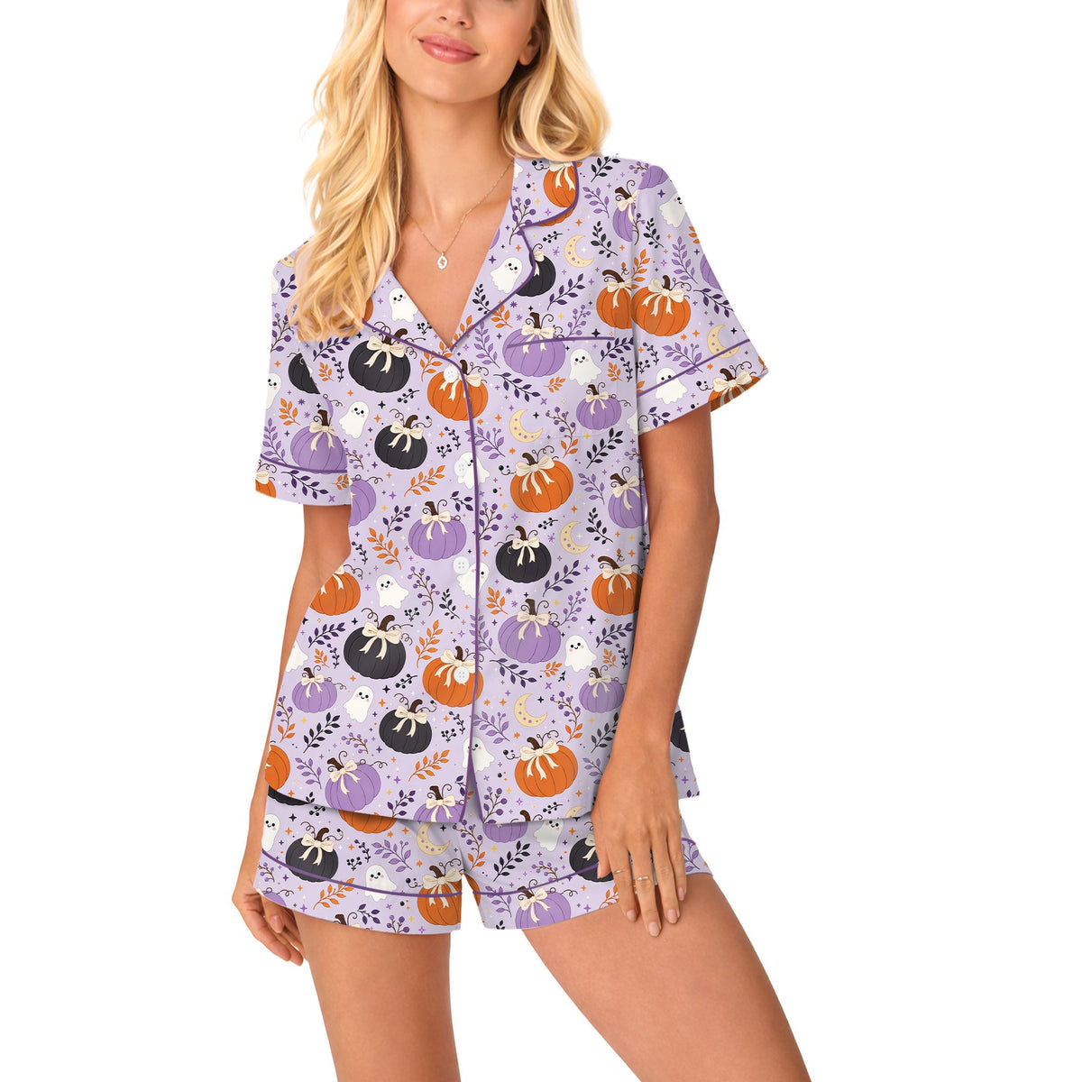 Adult wearing the matching family pajamas with pumpkin and moon pattern, front view