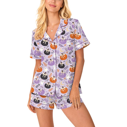 Adult wearing the matching family pajamas with pumpkin and moon pattern, front view