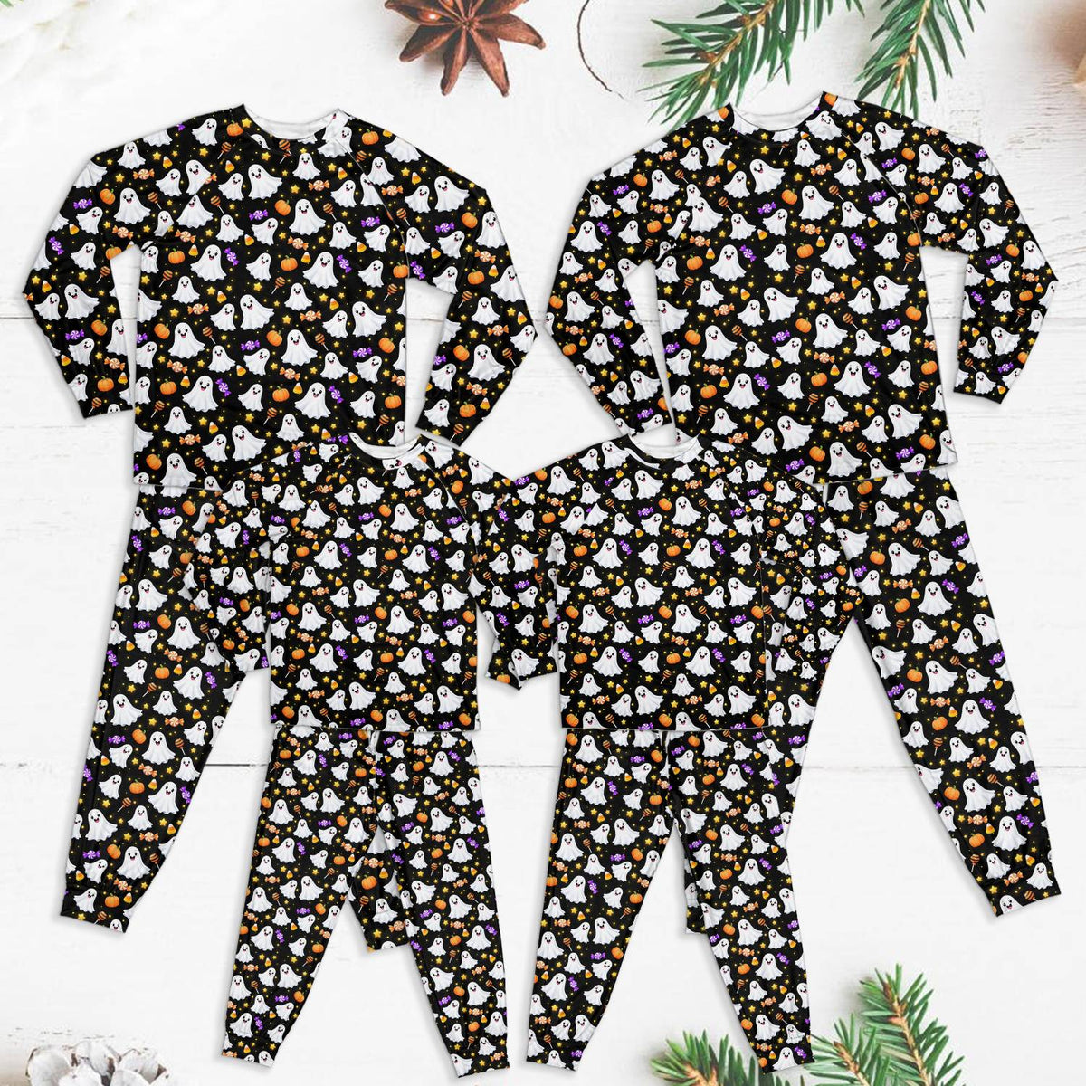 Matching family halloween pajama set with ghosts, pumpkins, and candy pattern, main view