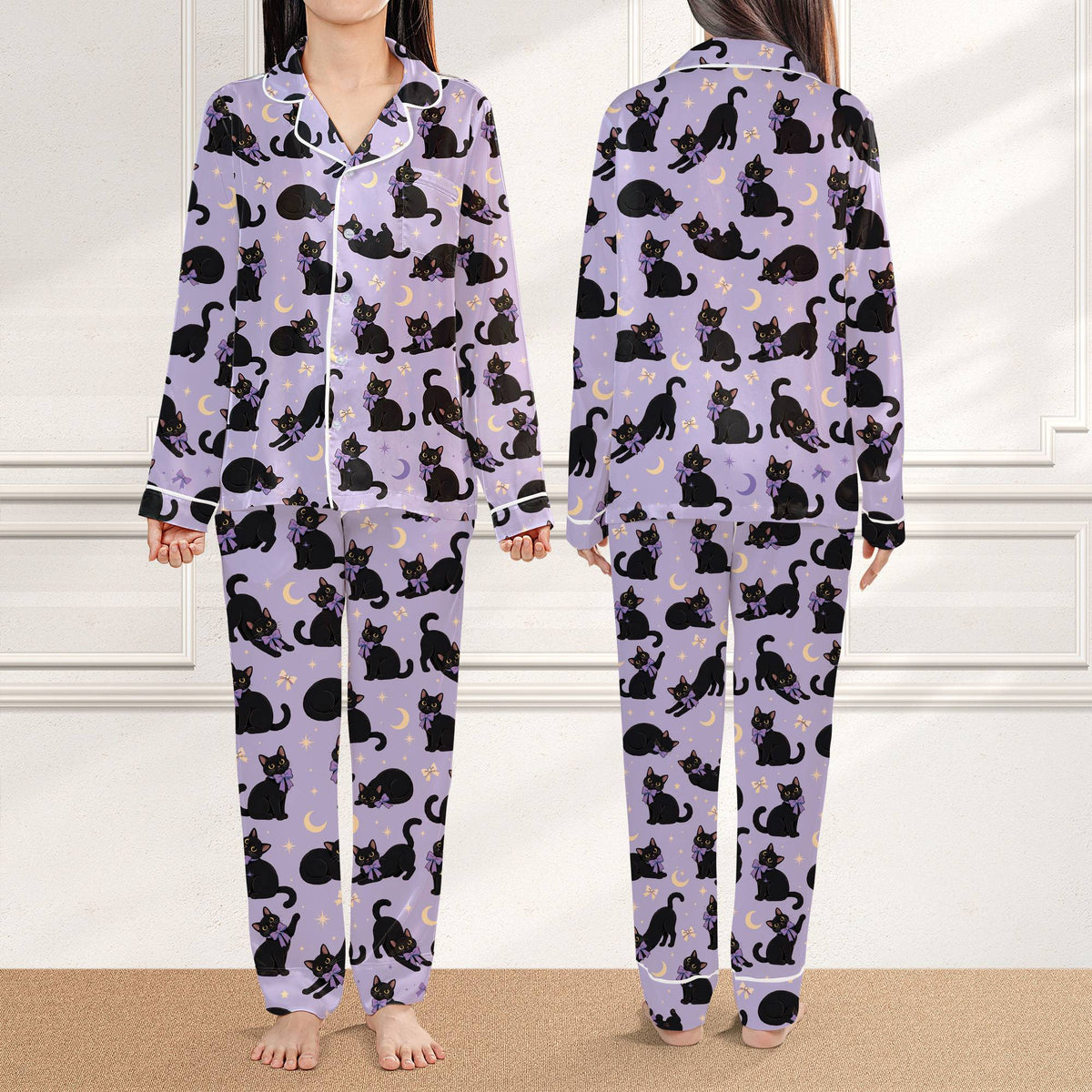 Front view of the light purple halloween pajama set featuring black cats and yellow moons