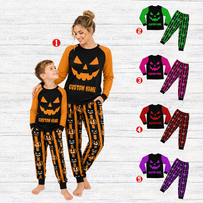 Lifestyle view of a family wearing multicolor matching pajamas for Halloween