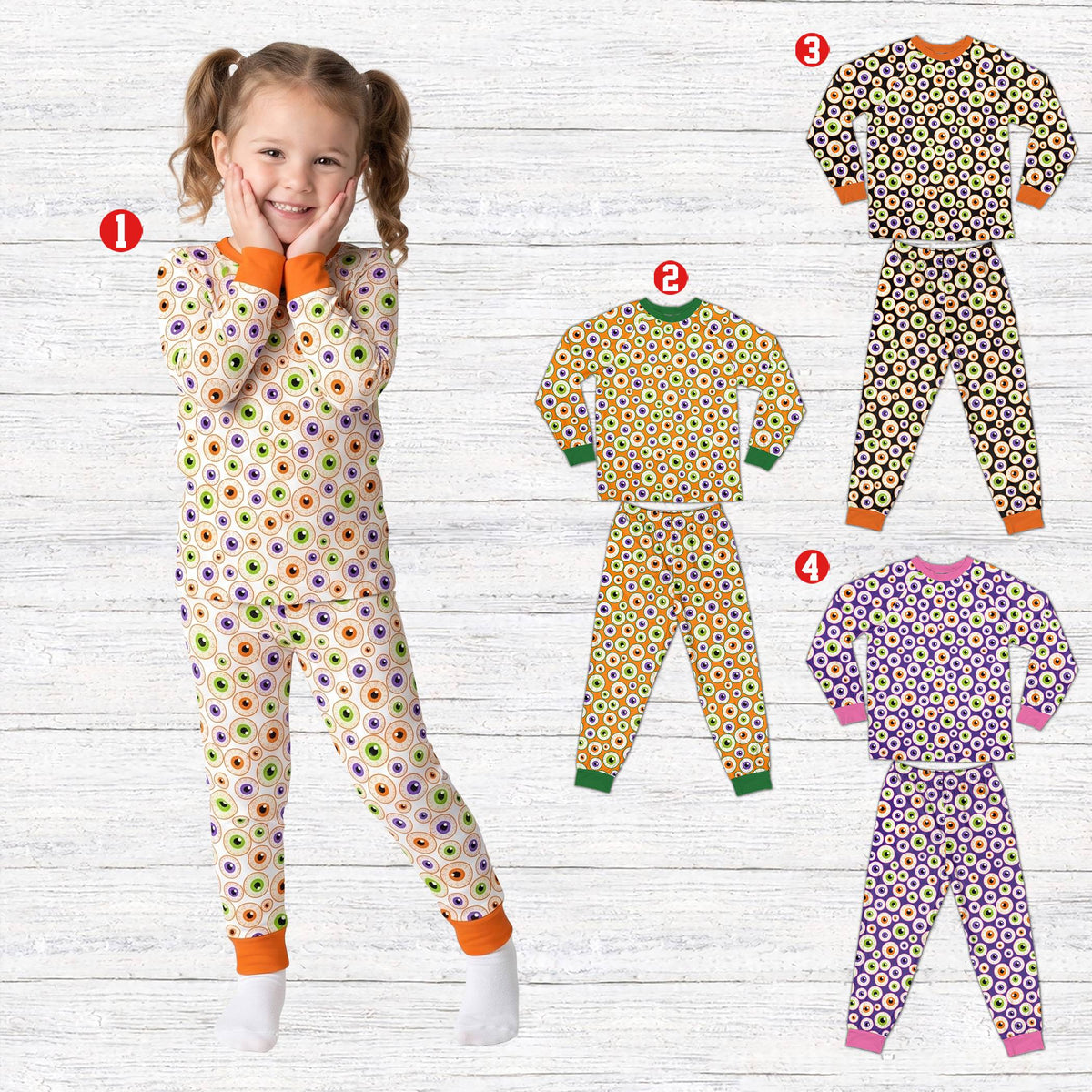 Family wearing matching holiday pajamas with Halloween eyeball print, lifestyle view