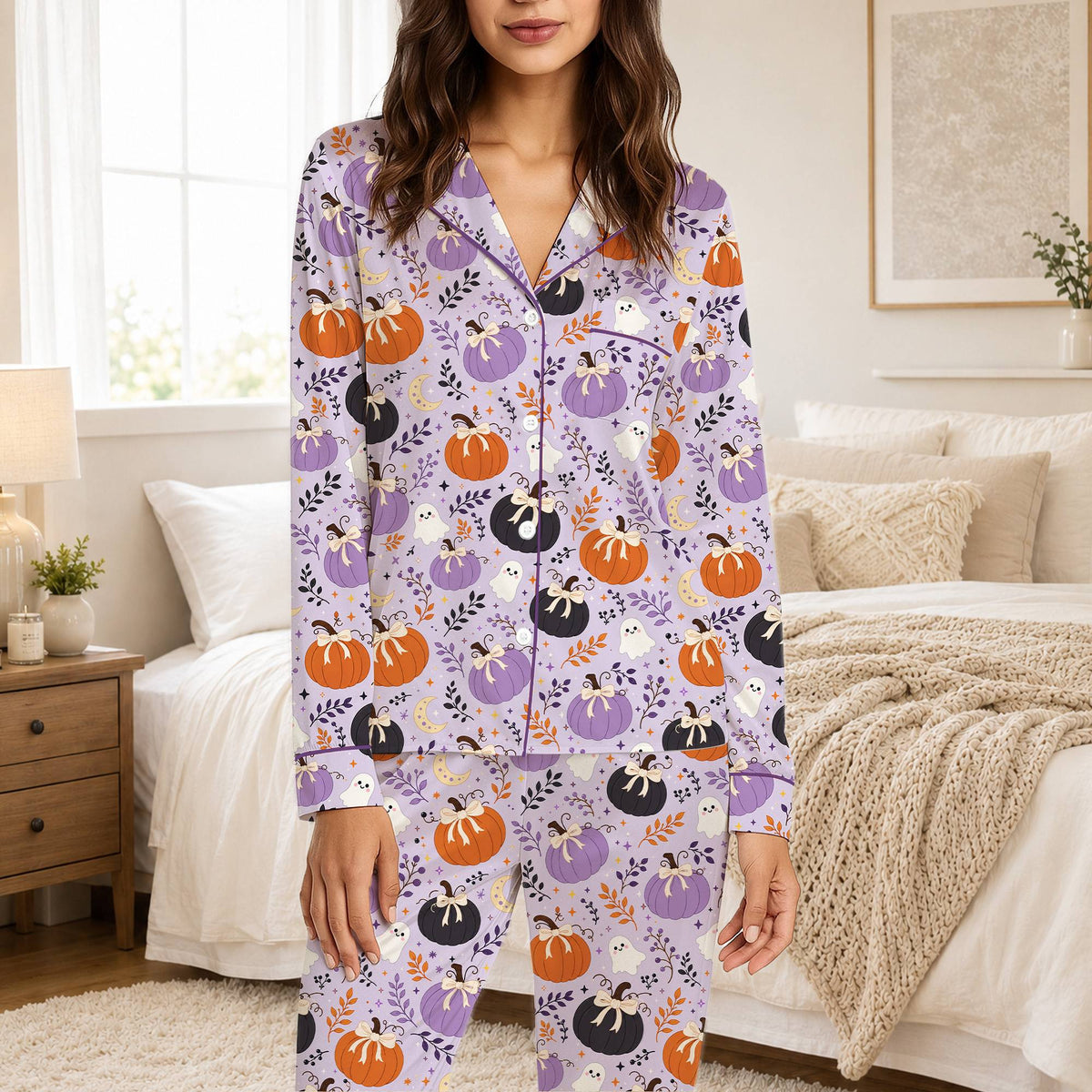 Front angle of the halloween pajama set with ghosts and crescent moons