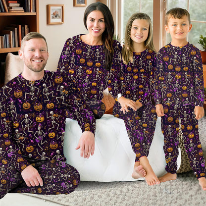 Fourth lifestyle view of the purple and orange Halloween pajama set in a cozy setting