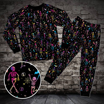 Front view of the black Halloween neon pajama set featuring skeletons and bats