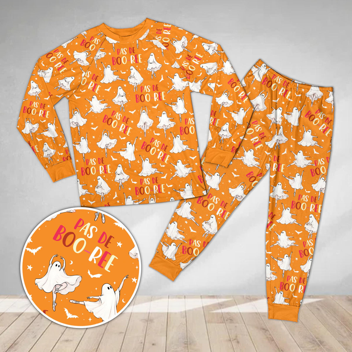 Orange family holiday matching pajamas with bat and star pattern, front view
