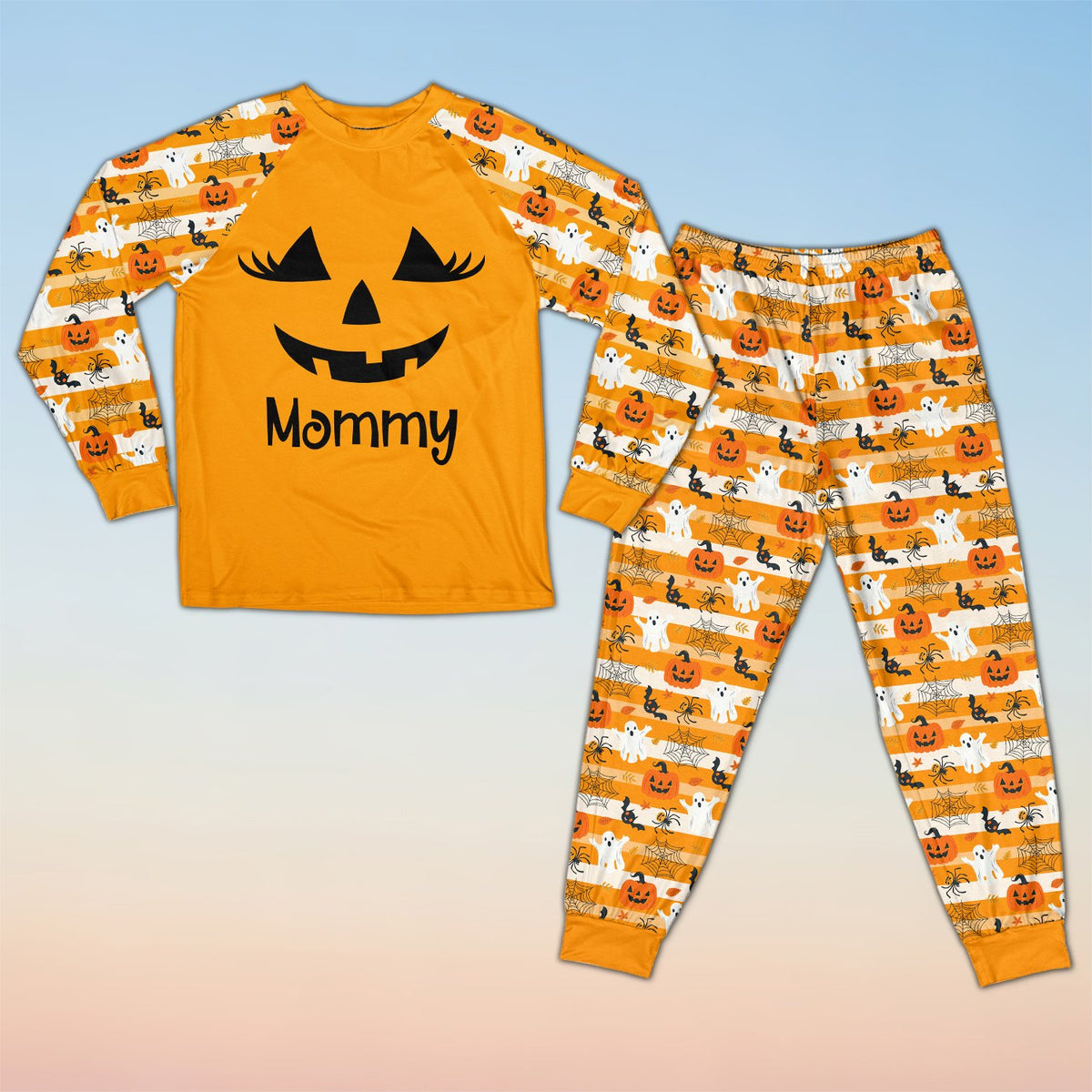 Front detail of the orange and black halloween pajama set top