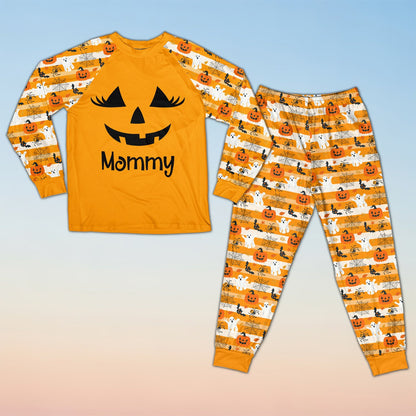 Front detail of the orange and black halloween pajama set top