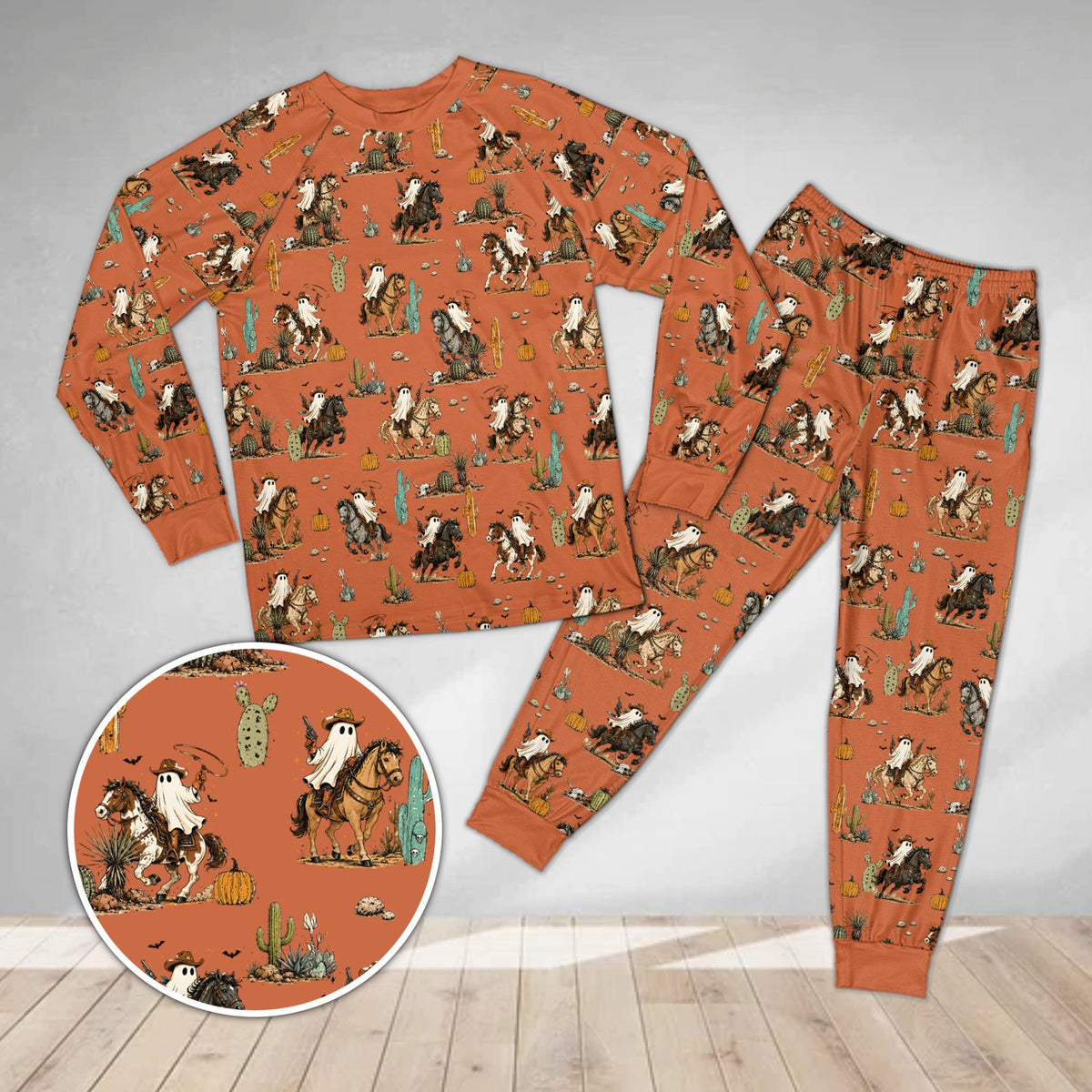Orange holiday family matching pajamas with pumpkin and bat design, front view