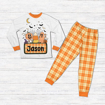 Front view of the personalized Halloween pajama set with orange accents
