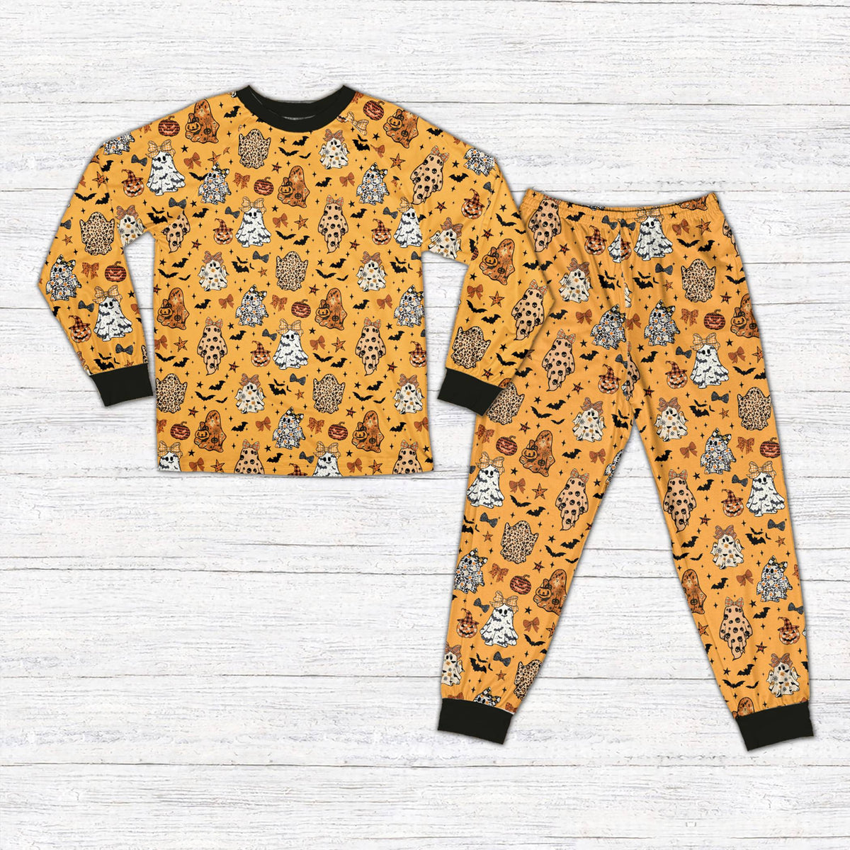 Orange halloween pajama set with leopard accents, front view