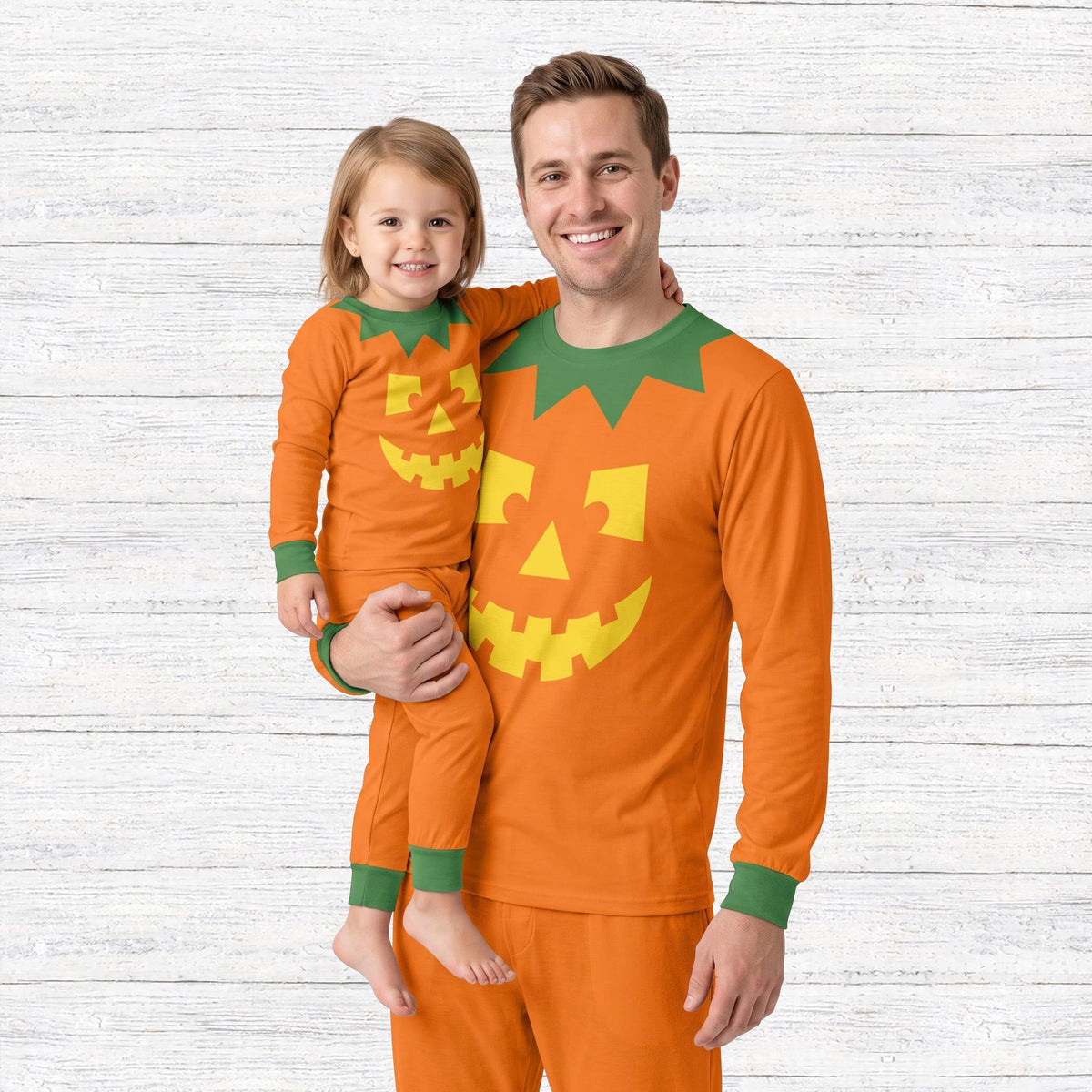 Lifestyle view of the matching family pajamas in a Halloween setting