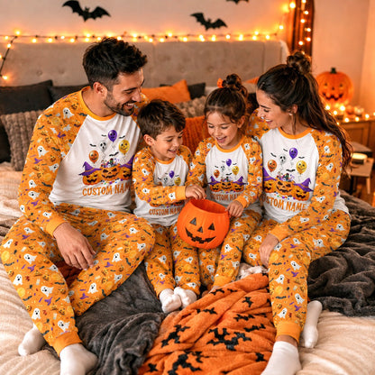 Lifestyle view of a family wearing the matching Halloween pajama set