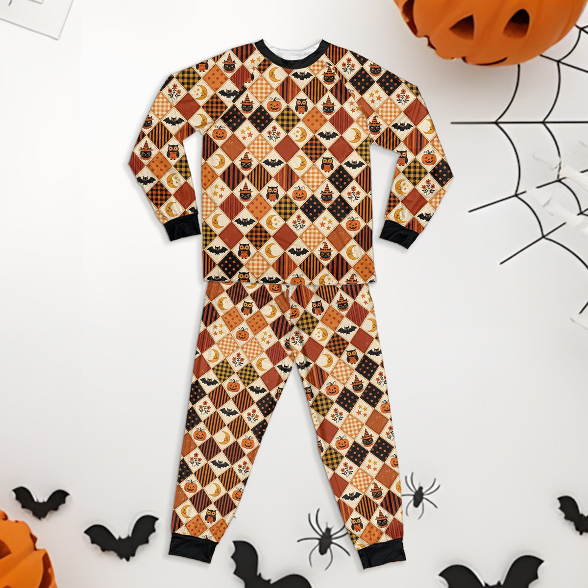 Matching family holiday pajamas with bat and owl design, alternate front view
