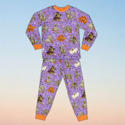 Front view of personalized purple Halloween dinosaur pajama set