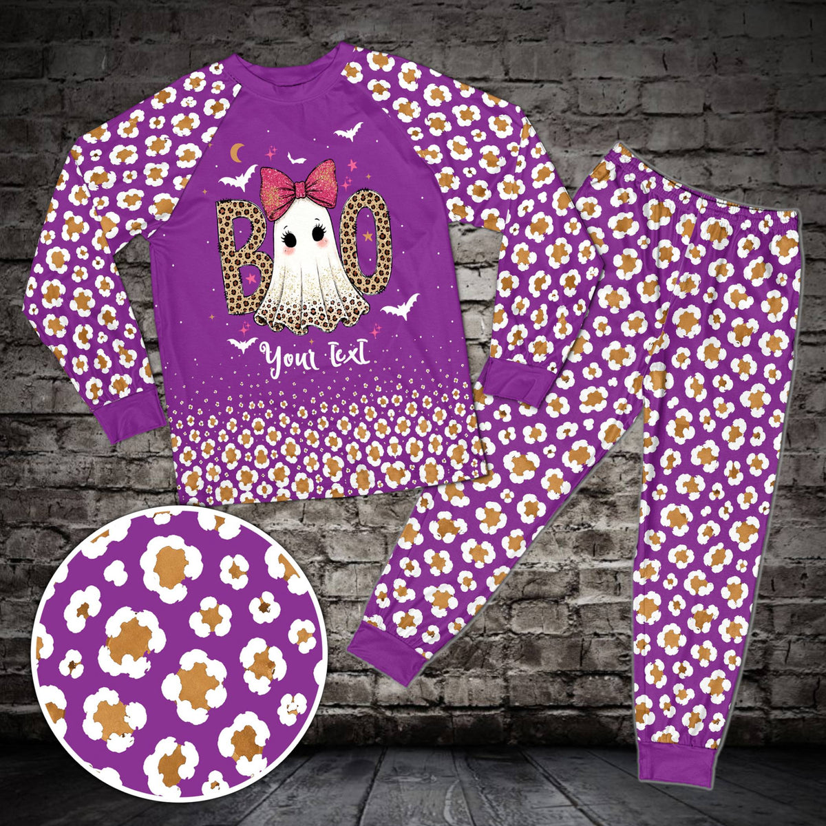 Front view of purple matching family pajamas with ghost and bats