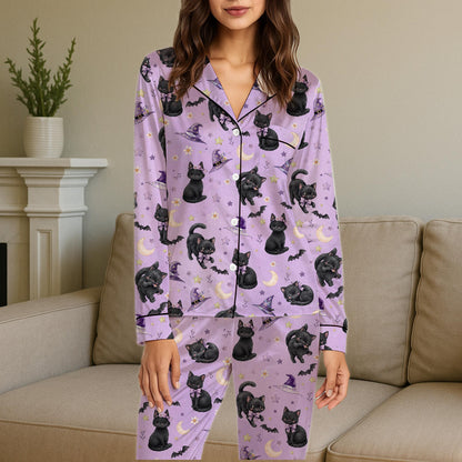 Lifestyle view of someone wearing the purple cat and bat Halloween pajamas