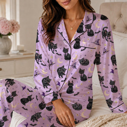 Lifestyle view of a family wearing the matching Halloween pajama sets