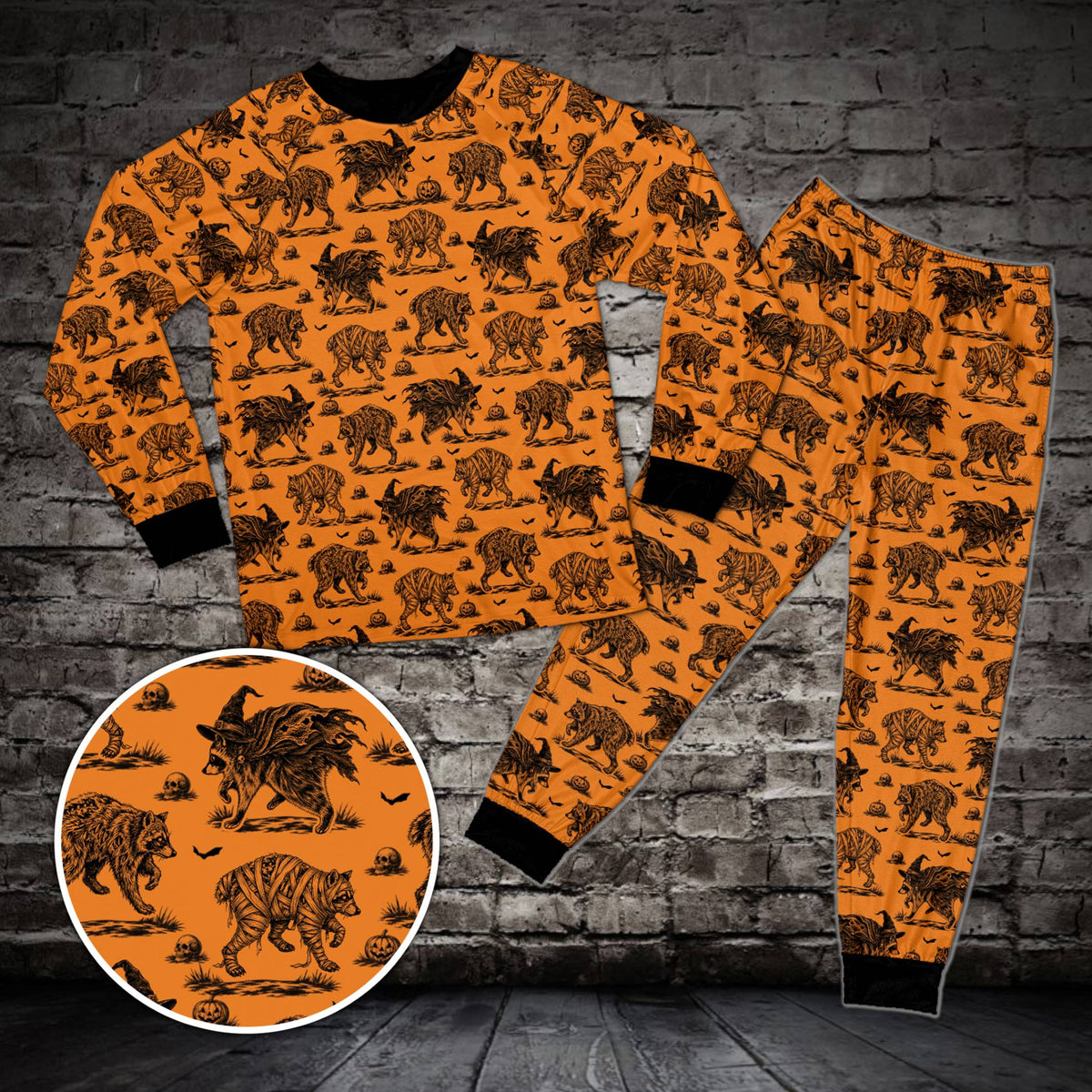 Orange Halloween raccoon pajama set featuring bats and skulls, front view